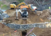 Trench being dug to place power lines in ground.